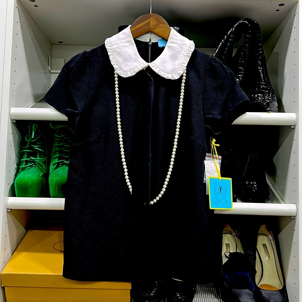 CeCe Classy Black/White blouse. New w tags. Size XS.